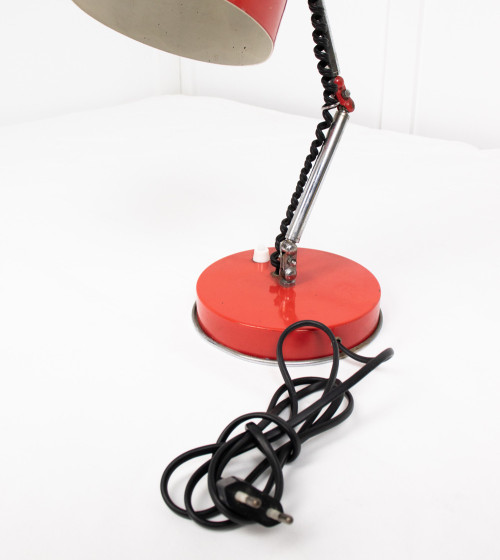 Articulated red table lamp